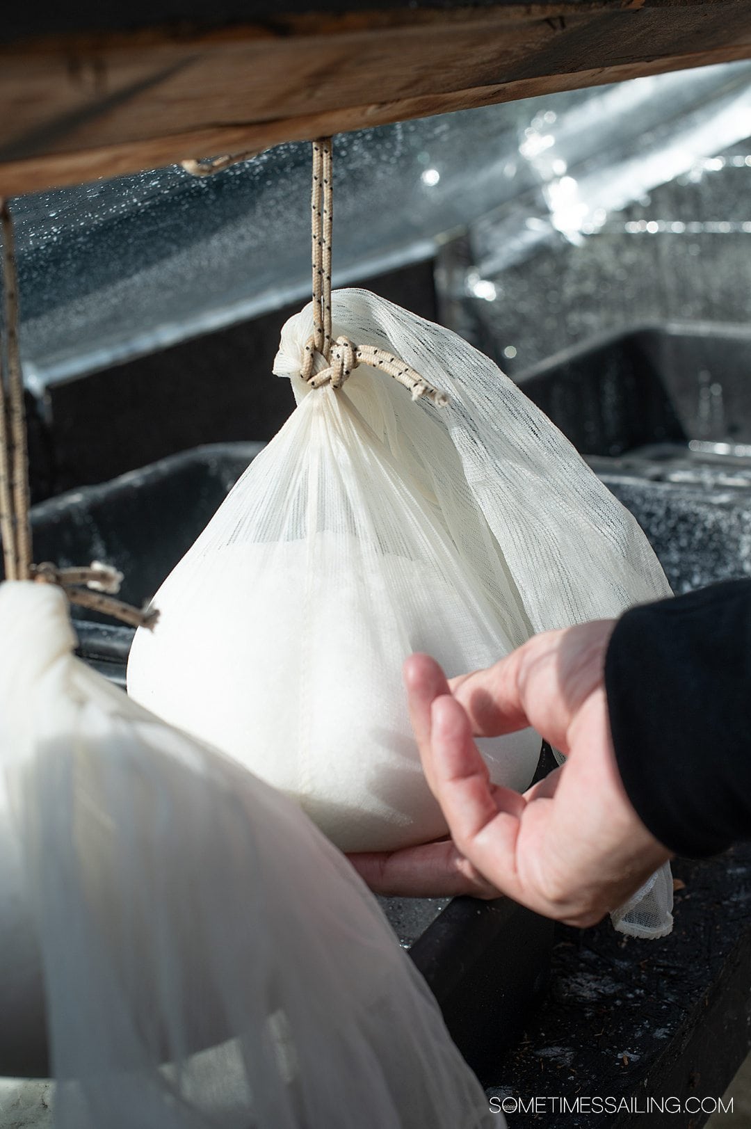 Photo of a ball of cheesecloth with salt inside.