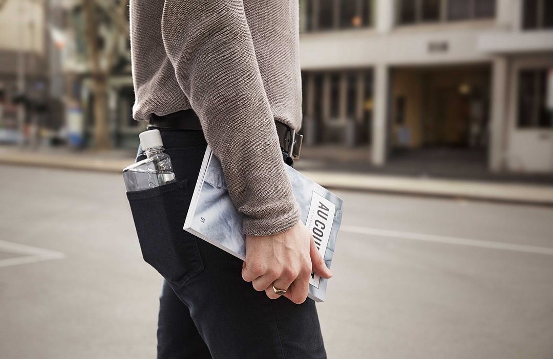 memobottle image in the back pocket of a man's black jeans.