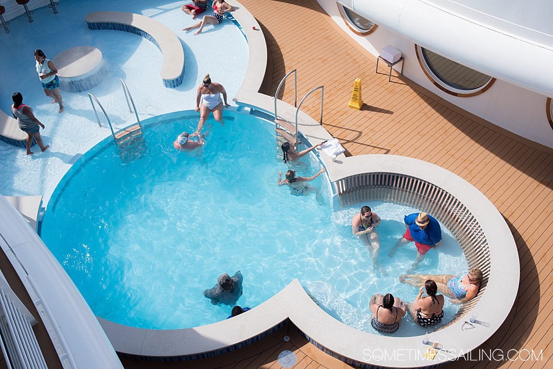 Looking down on a circle pool on the top deck of a cruise ship, an adult-only area for people on Disney cruise, without kids.
