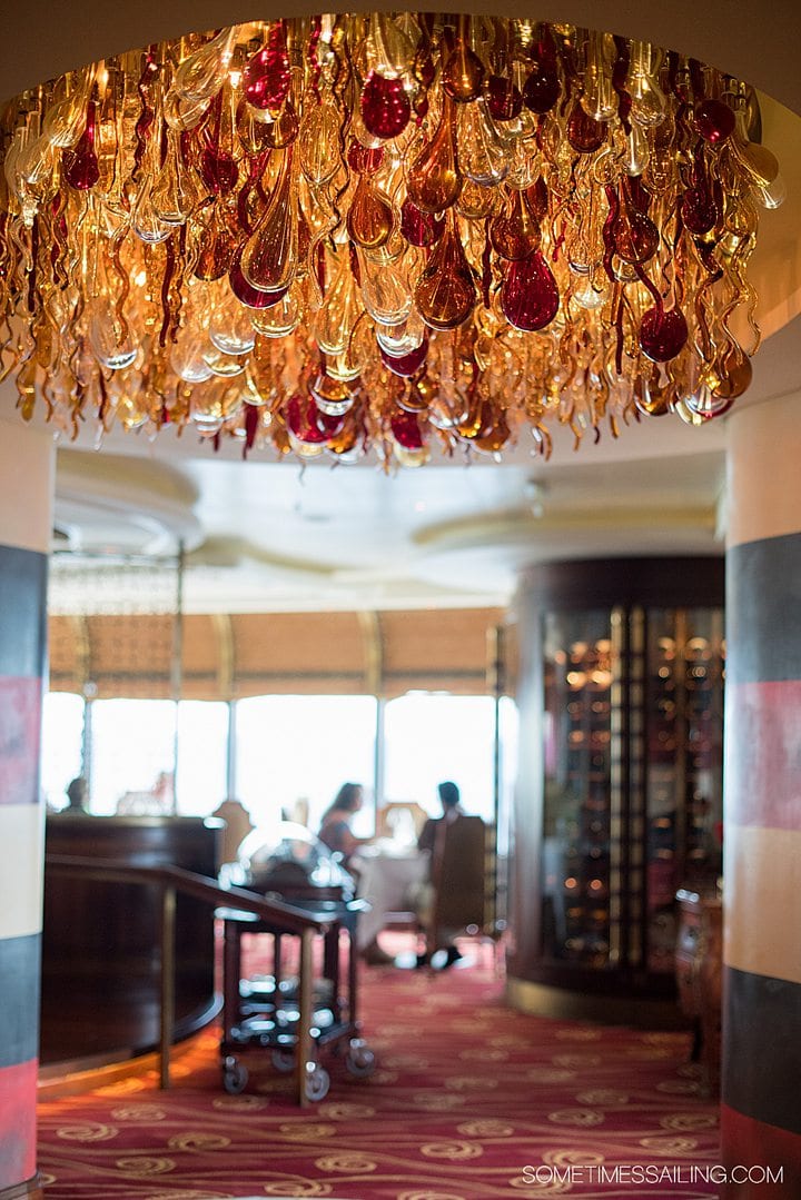 Red and orange glass chandelier in Palo aboard the Disney Cruise Line Dream ship, without kids.