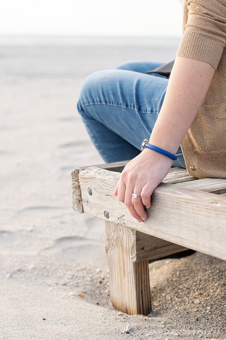 Blue rubber and stainless steel sailing bracelet from OMEGA on a female.