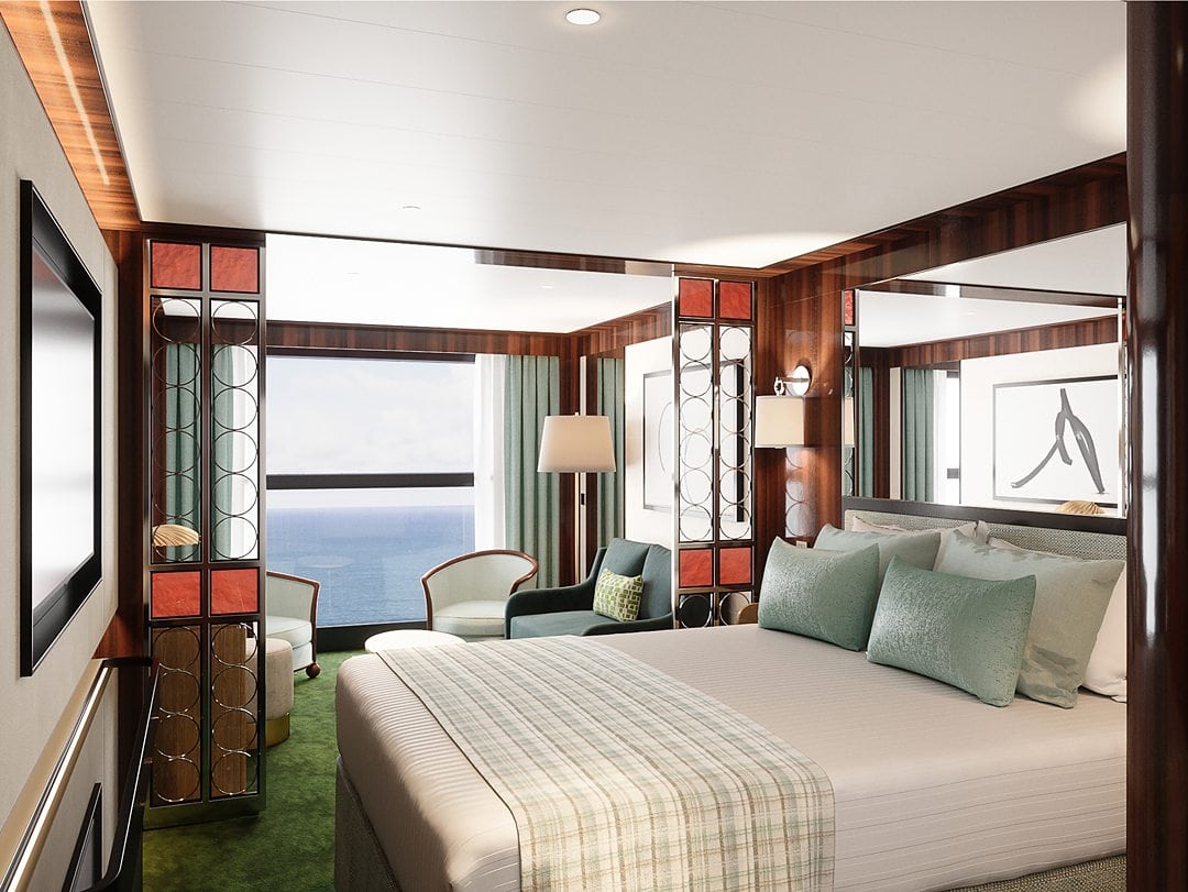 Cabin with a bed and chairs, and mint green details on a cruise ship called the World Navigator, with Atlas Ocean Voyages.