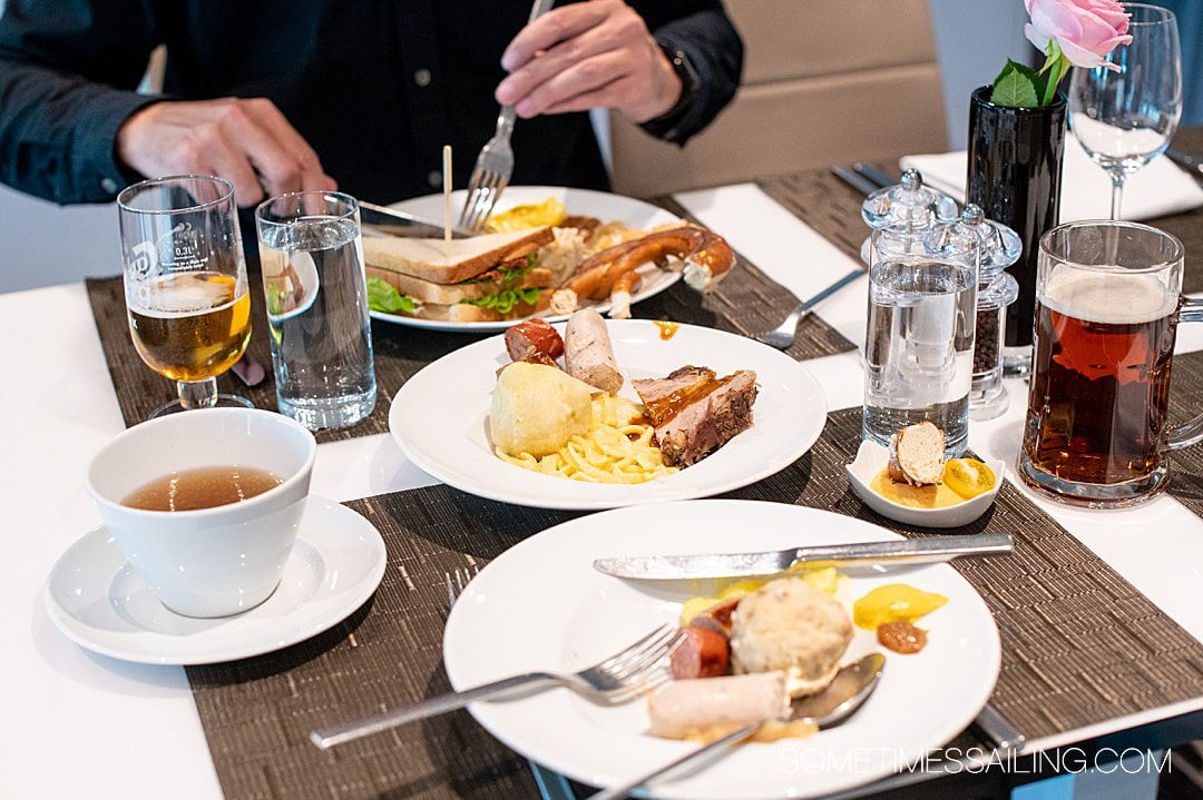 Table with plates of traditional Austrian food during a lunch on Emerald Destiny river cruise ship.
