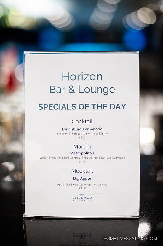 Sign with drinks of the day at Horizon Bar and Lounge on Emerald Destiny river cruise ship.