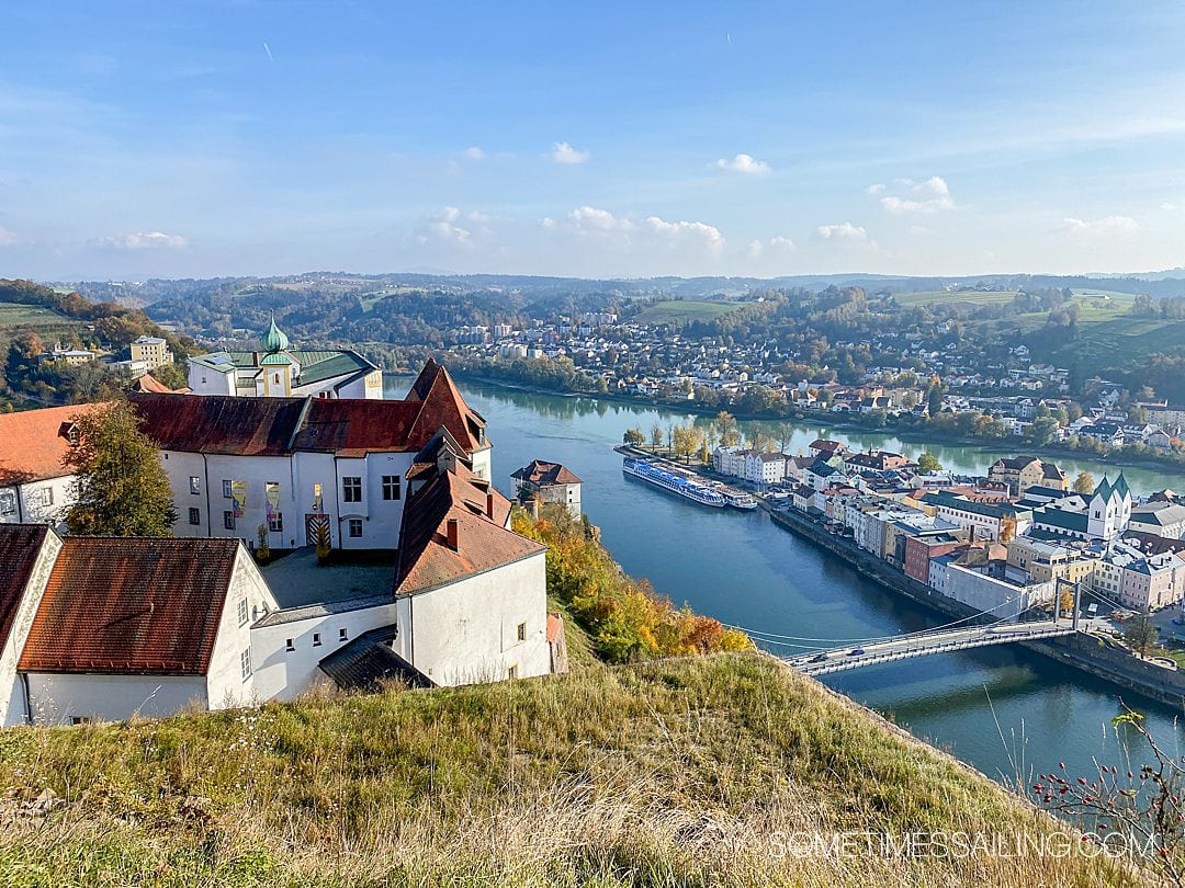 Bird's eye view of of two rivers and a city below in Passau, Germany.