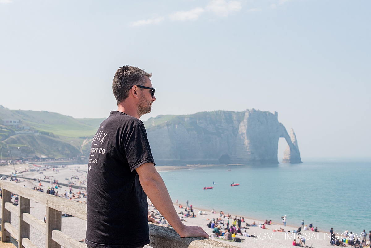 Man overlooking the beaches of Normandy at the Cliffs at Etratat, during a trip to northern France.