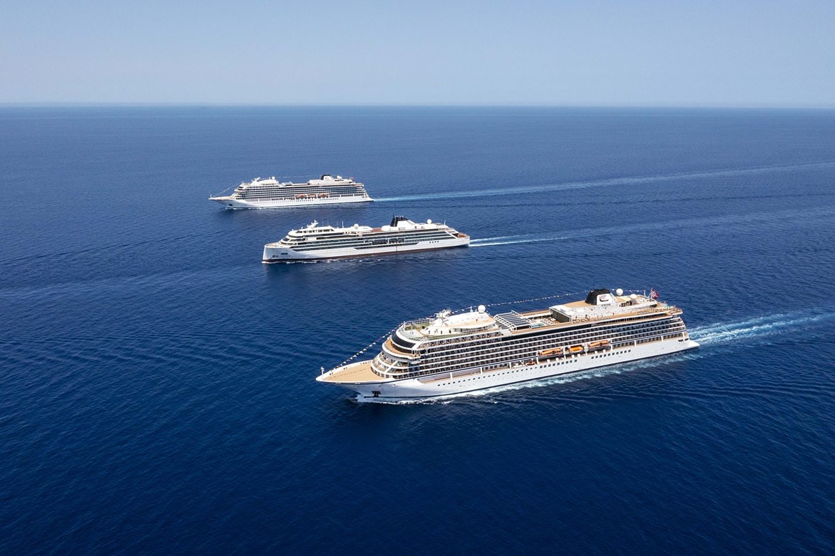 Three Viking cruise ships in the ocean.