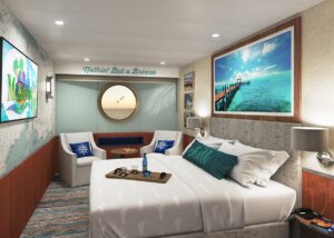 Inside stateroom onboard Margaritaville at Sea cruise ship with nautical details and blue and neutral colors.