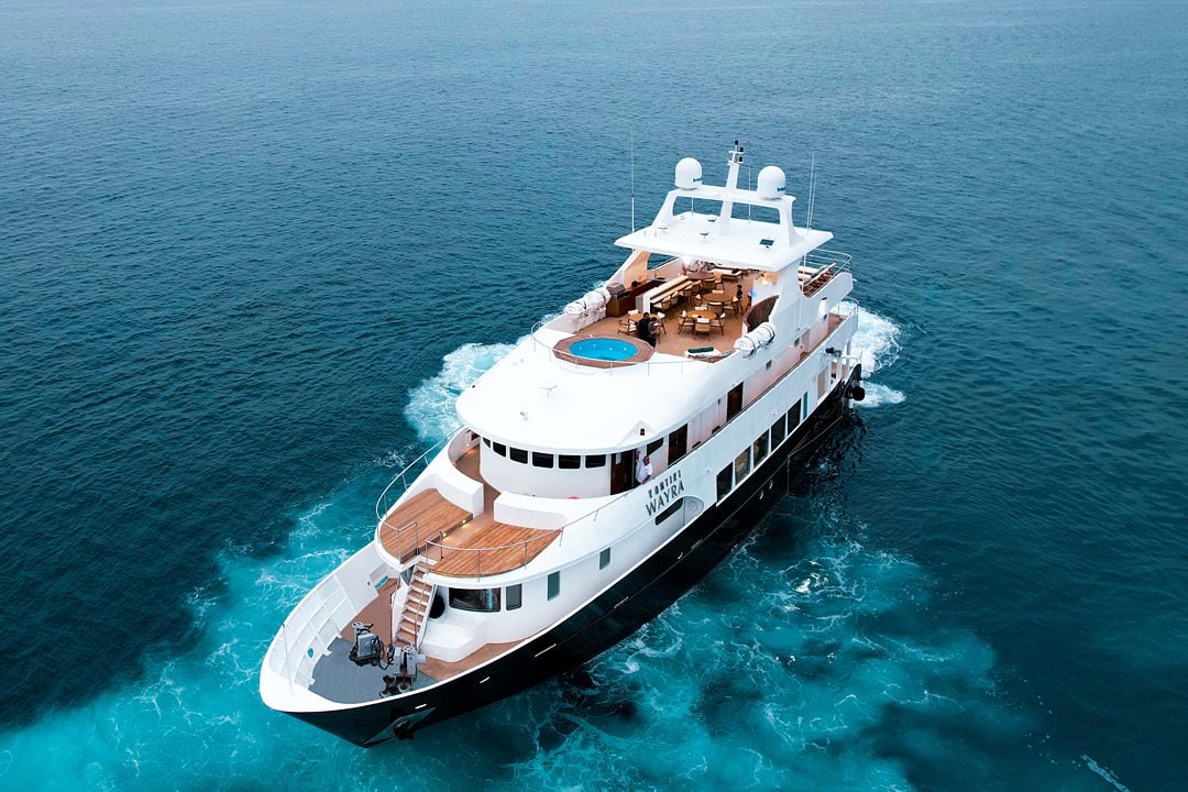 Kontiki Expeditions Ecuador Yacht Cruise, with an aerial view of the boat in the water.