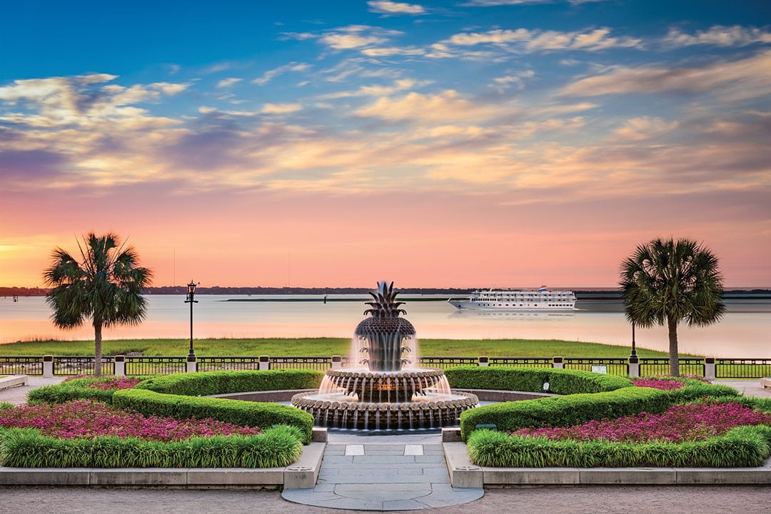 American Cruise Lines ship passing by the pineapple fountain in Charleston, during a US River Cruise.