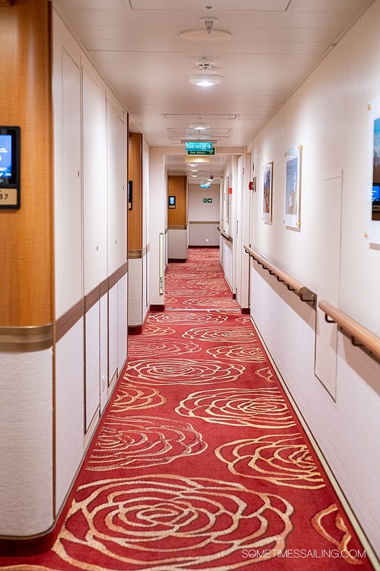 Red carpet with a floral print on Majestic Princess cruise ship - helps a guest identify port vs starboard sides of the boat.