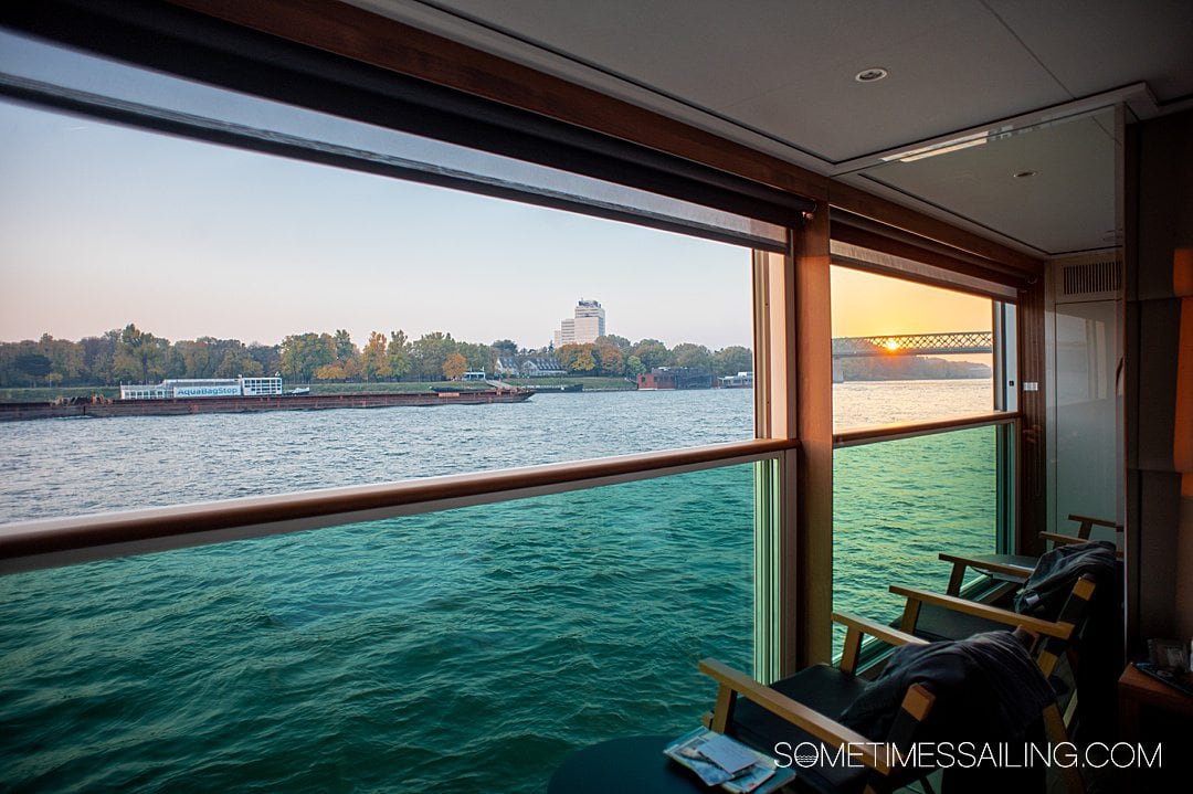 Looking out a panorama balcony on a river cruise ship on the Danube River.