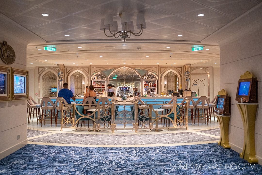 Enchanted Sword Cafe bar with blue and gold details on Disney Wish cruise ship.