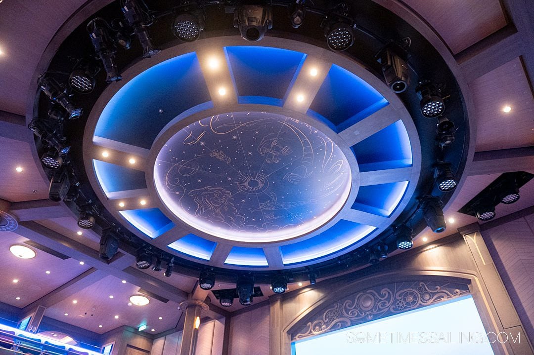Ceiling of Luna with painted "constellations" and theatrical lighting on Disney Wish cruise ship.