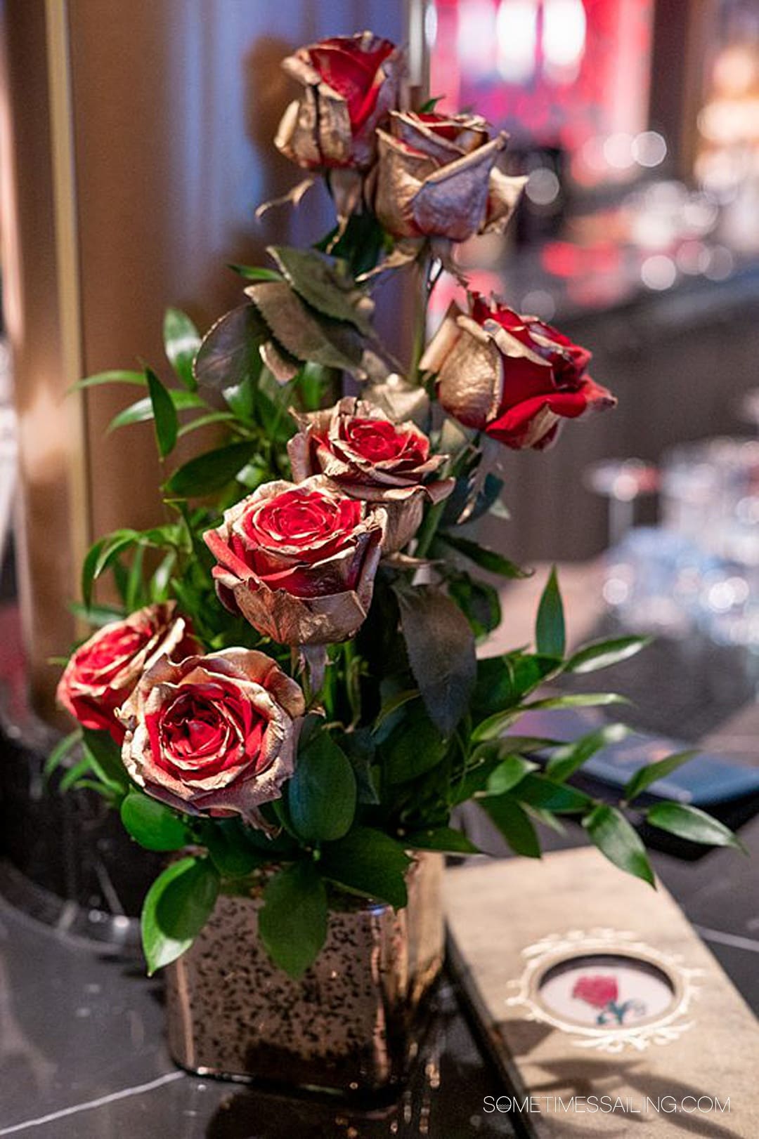 Gold-painted red roses at The Rose bar on Disney Wish.