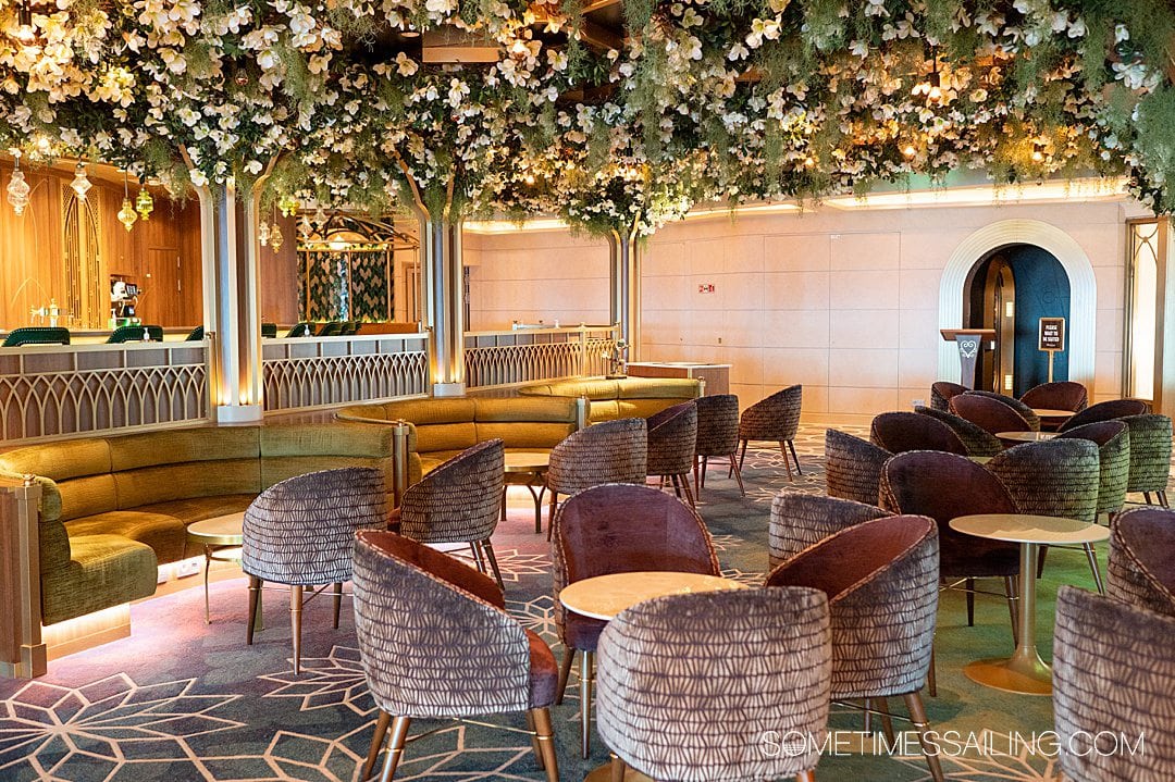 The Bayou on Disney Wish cruise ship with lounge seating and magnolias and Spanish moss on the ceiling.