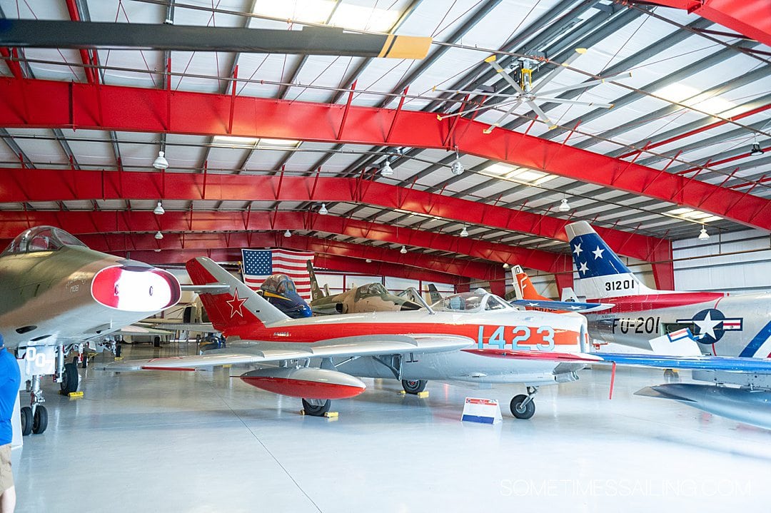 Red hangar with vintage airplanes at the Valiant Air Command Warbird museum.