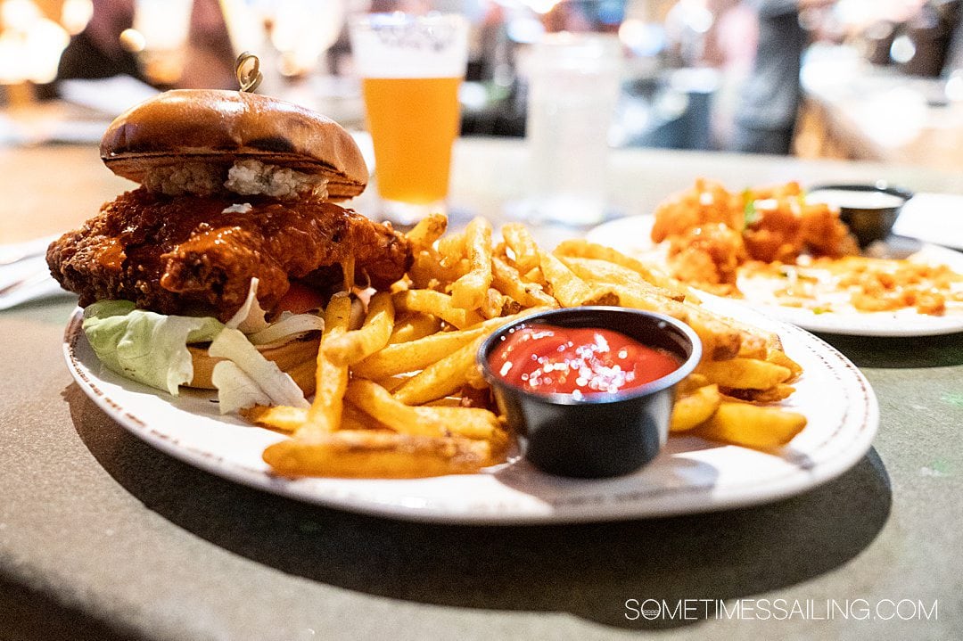 Plate of fries and a fried chicken sandwich at Playalinda Brew Co. in Titusville.