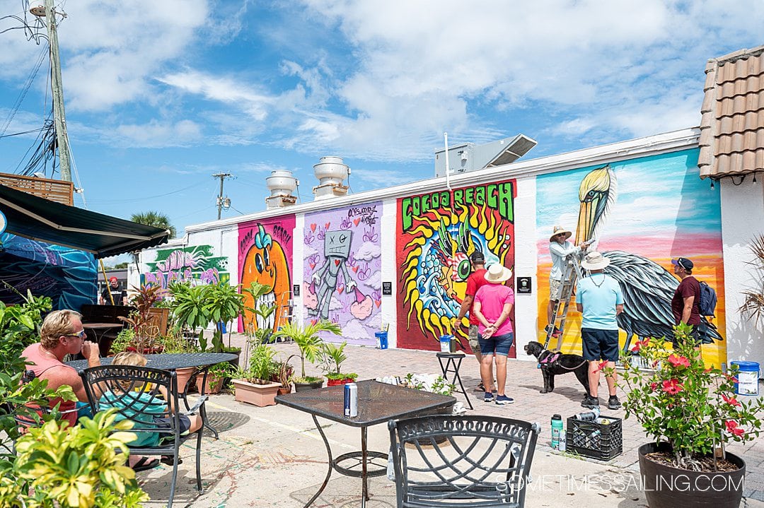 Seeing murals like these colorful paintings in one of the things to do near Port Canaveral in Cocoa Beach on a blue sky, sunny day.