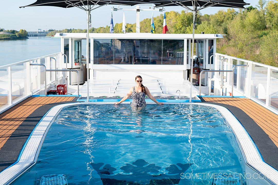 Woman in the heated pool on the sundeck of AmaKristina river cruise ship with AmaWaterways.