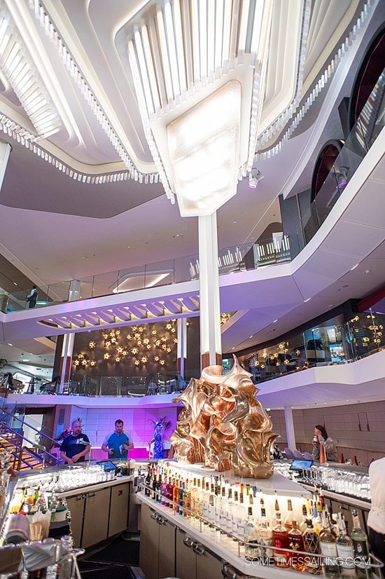 Main Martini Bar area in the three-deck spanning atrium on Celebrity Beyond cruise ship.