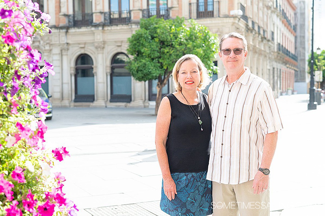 Man and a women standing side by side outside.