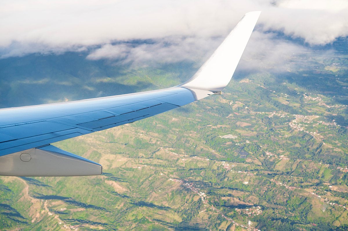 Airplane wing flying over Costa Rica.