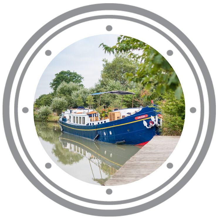 Barge cruise ship photo in a graphic porthole.