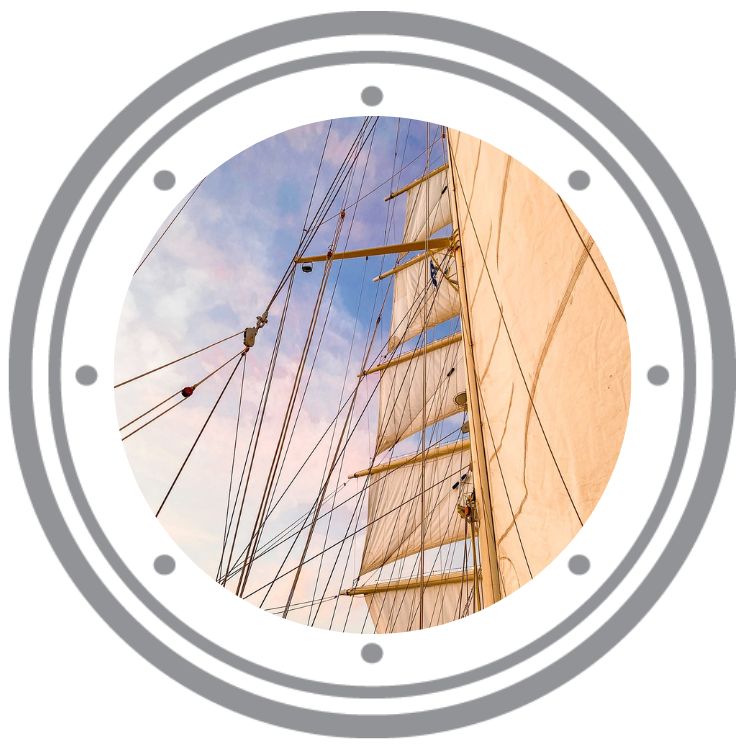 Sailing Star Clippers cruise ship with a purple and blue sunset sky in a graphic porthole.