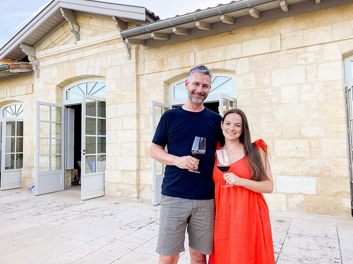 Couple with two glasses of red wine with Viking Cruises on a Bordeaux River Cruise in France.