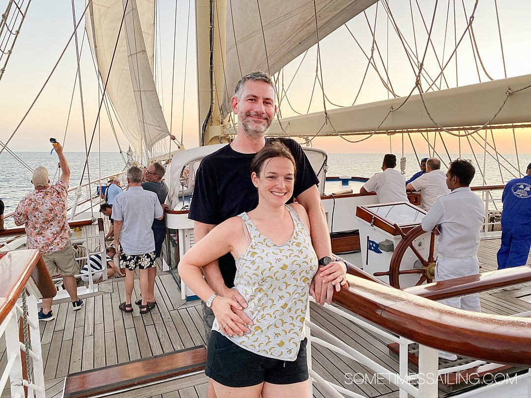 Man and woman on the top deck of Star Clipper sailing cruise ship.