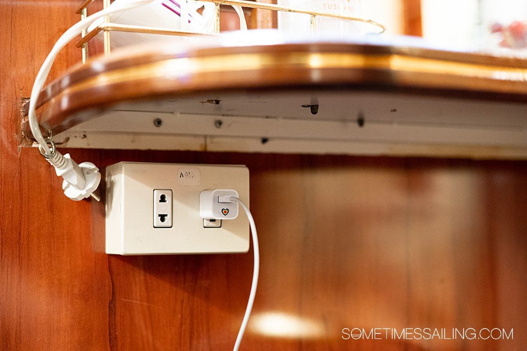 White outlet with two plugs on Star Clipper, inside a cabin.