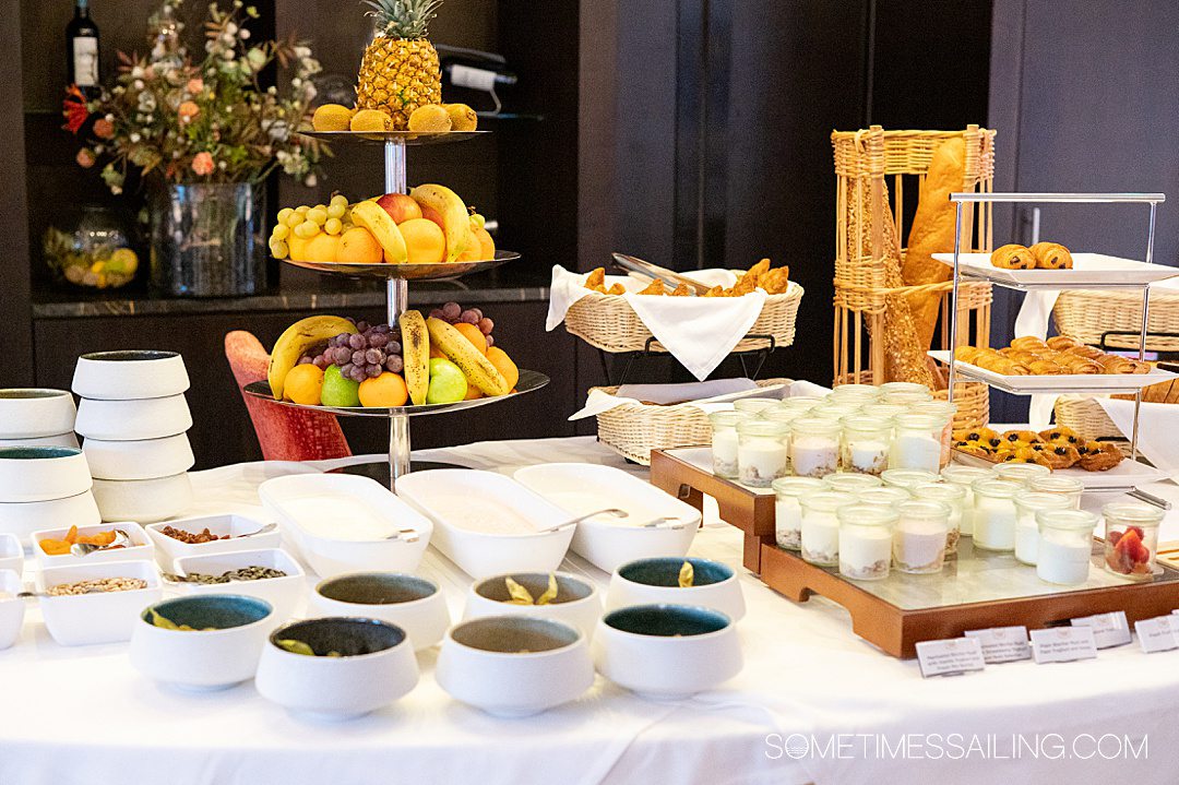 Table of breakfast food, including yogurt bowls and fruit for an AmaWaterways food review.