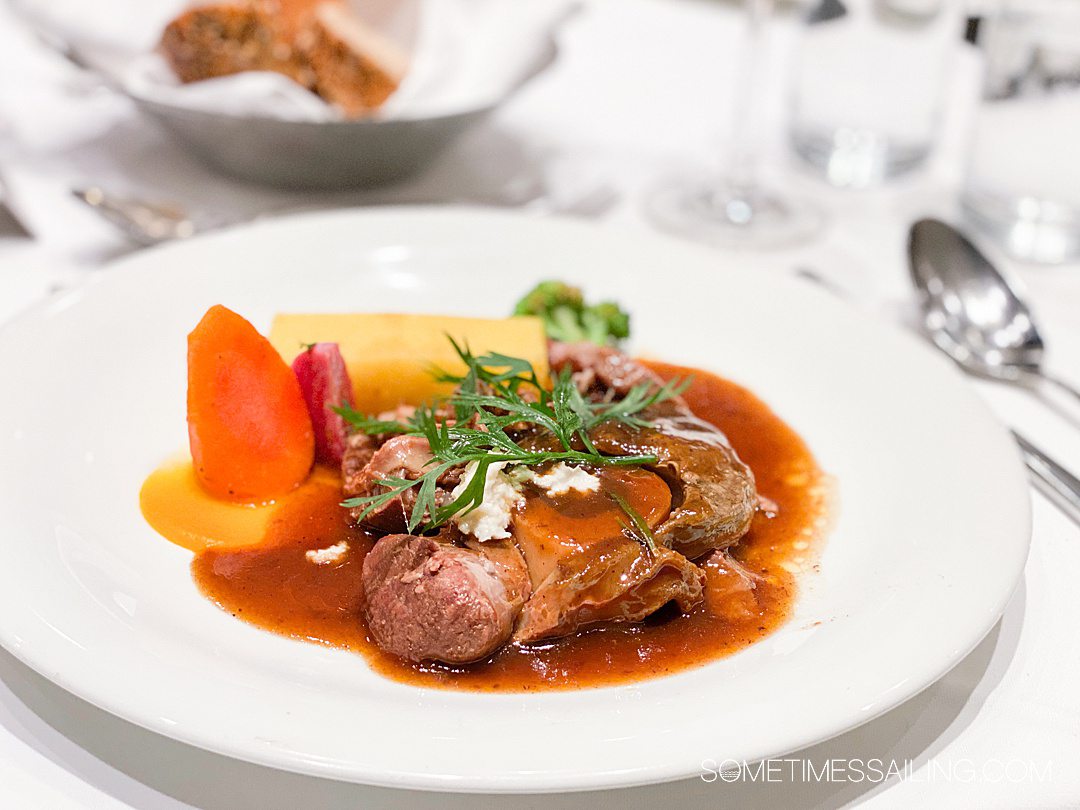 Dinner plate of meat and potatoes with gravy for an AmaWaterways food and drink review.