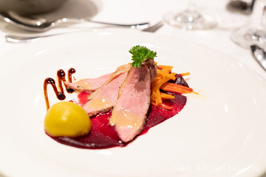 Sliced duck appetizer plate with carrots for an AmaWaterways food review on a river cruise in France.