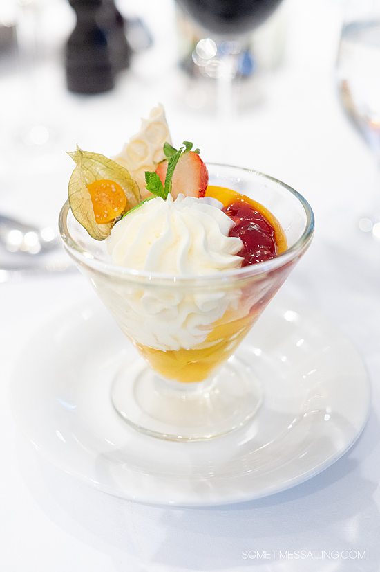 Bowl of dessert with fruit and whipped cream aboard AmaKristina cruise ship.