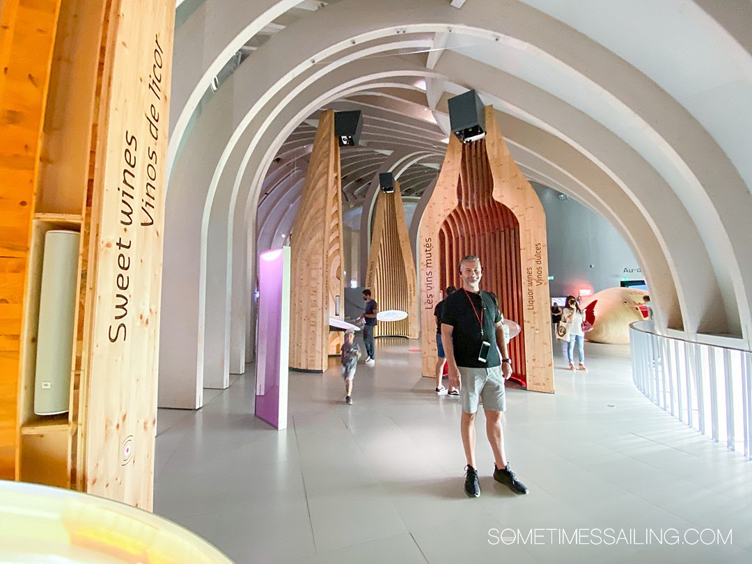 Man in a museum for wine in Bordeaux's Cite du Vin.