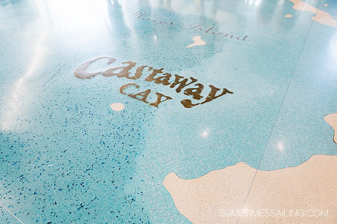 "Castaway Cay" letters on a blue floor at the Disney Cruise Line terminal, on embarkation day at Port Canaveral.
