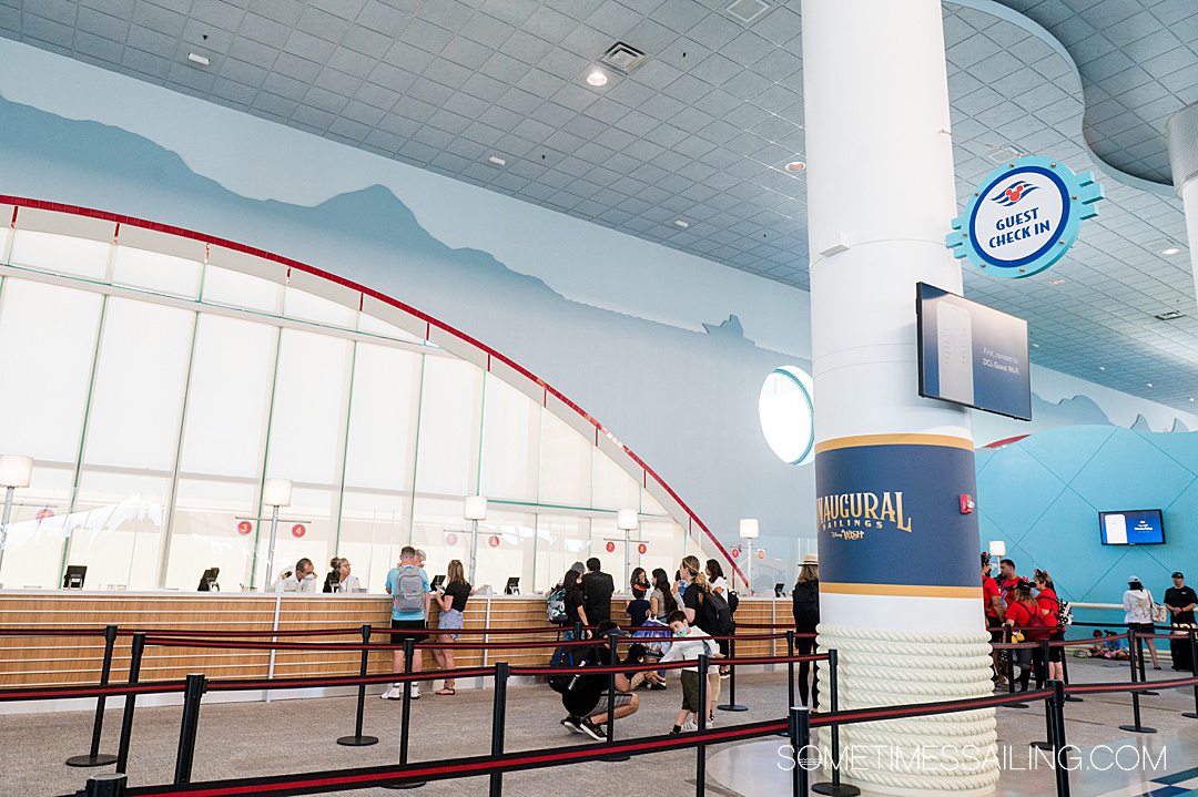 Counter inside the Port Canaveral Disney Cruise Line terminal, with high ceilings and an arched window.