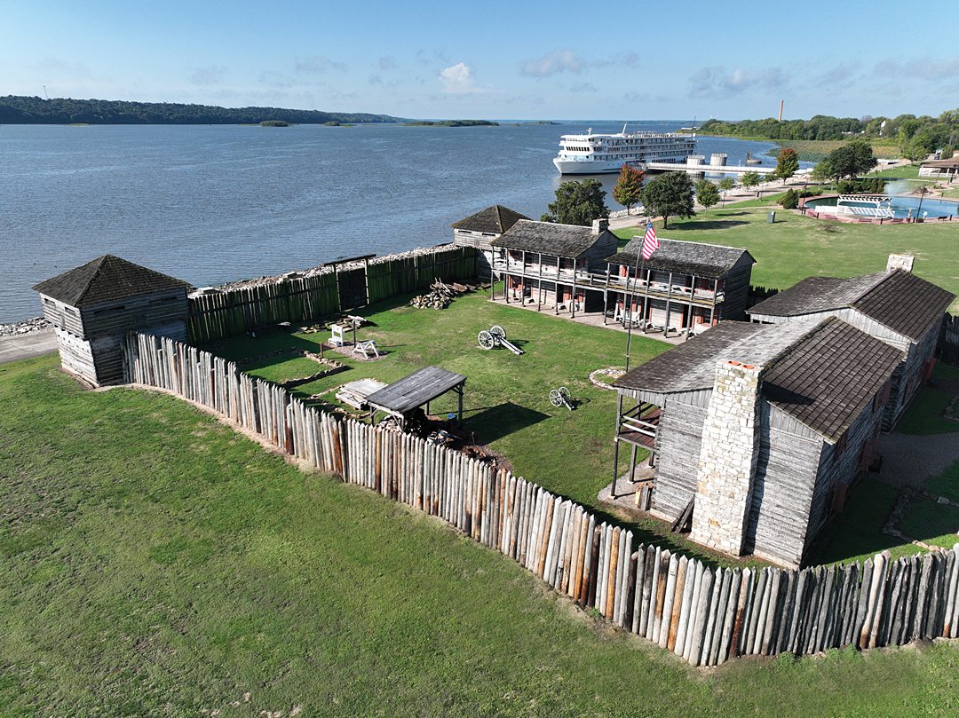Fort Madison seen from above and a river cruise ship in the distance.