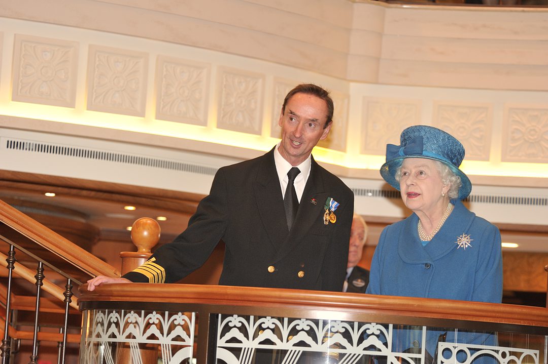 Cunard Queen Elizabeth naming Ceremony. Queen Elizabeth II on a staircase landing in the Grand Lobby.
