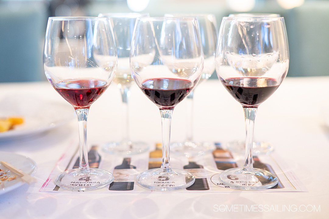 Glasses lines up on a placemat for a Greek wine tasting aboard Celestyal Cruises.