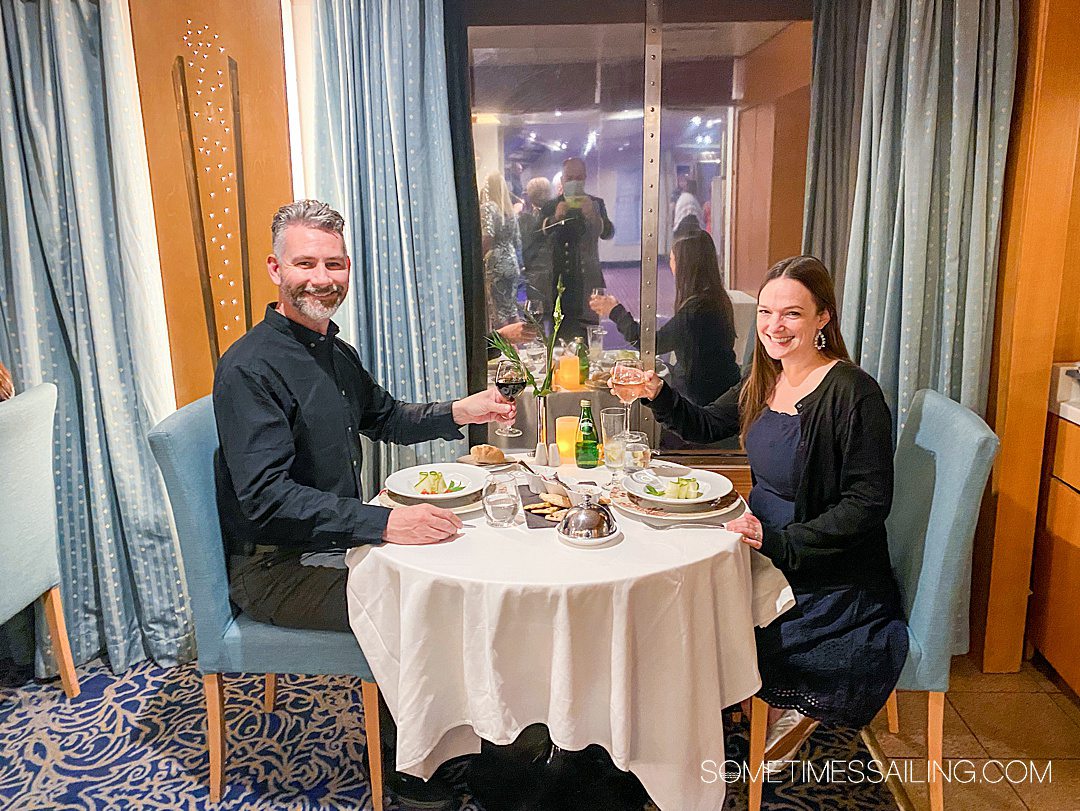 Couple dining at a round table during a Celestyal Cruises Greek table dining experience.