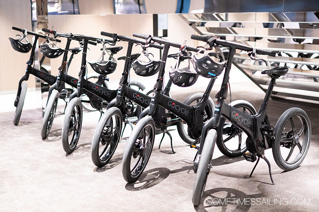 Black Gocycle electric bicycles lined up inside a cruise ship for Caribbean cruise excursions.