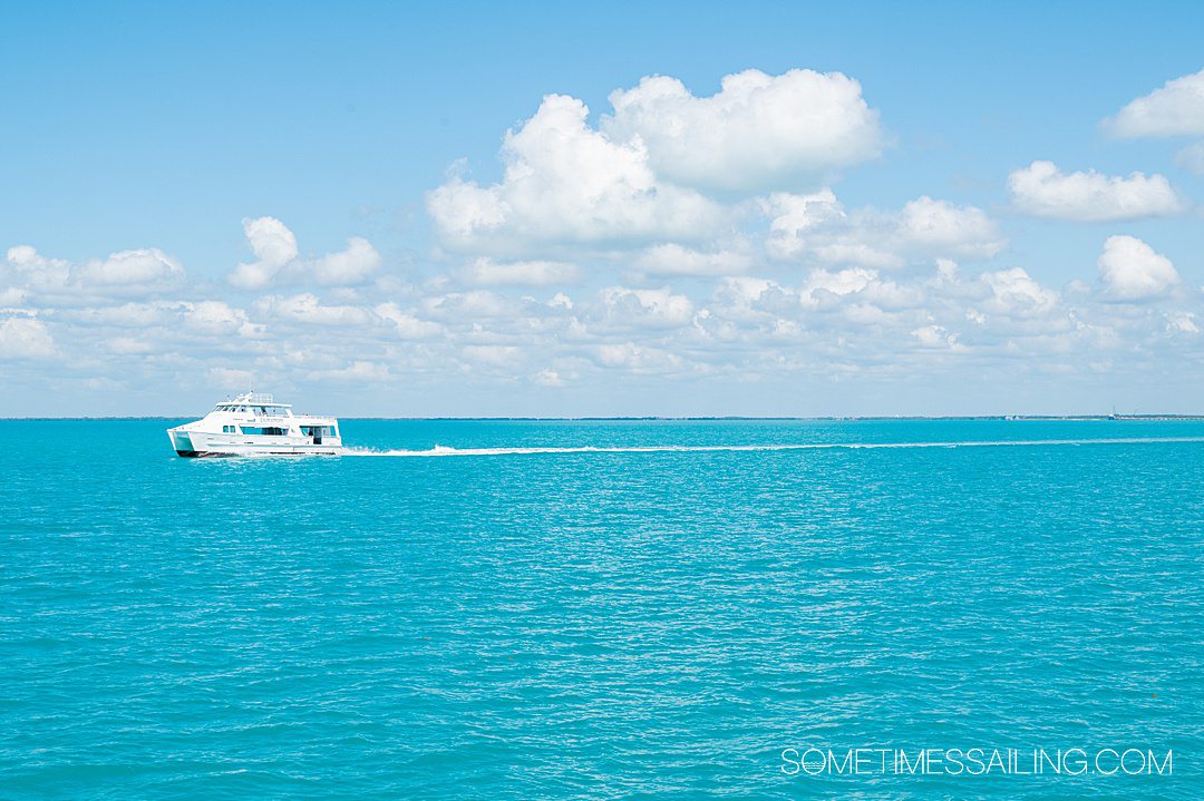 Turquoise ocean with a motorboat in the distance, seen during a Southern Caribbean cruise.