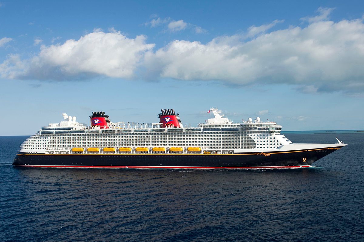 Disney Dream cruise ship from Disney Cruise Line in the ocean with a blue sky.