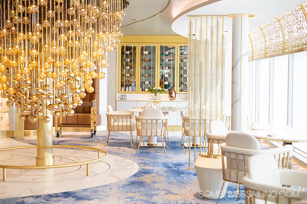 Looking in the blue, white and gold restaurant, Enchante, for adults-only on Disney Wish cruise ship.