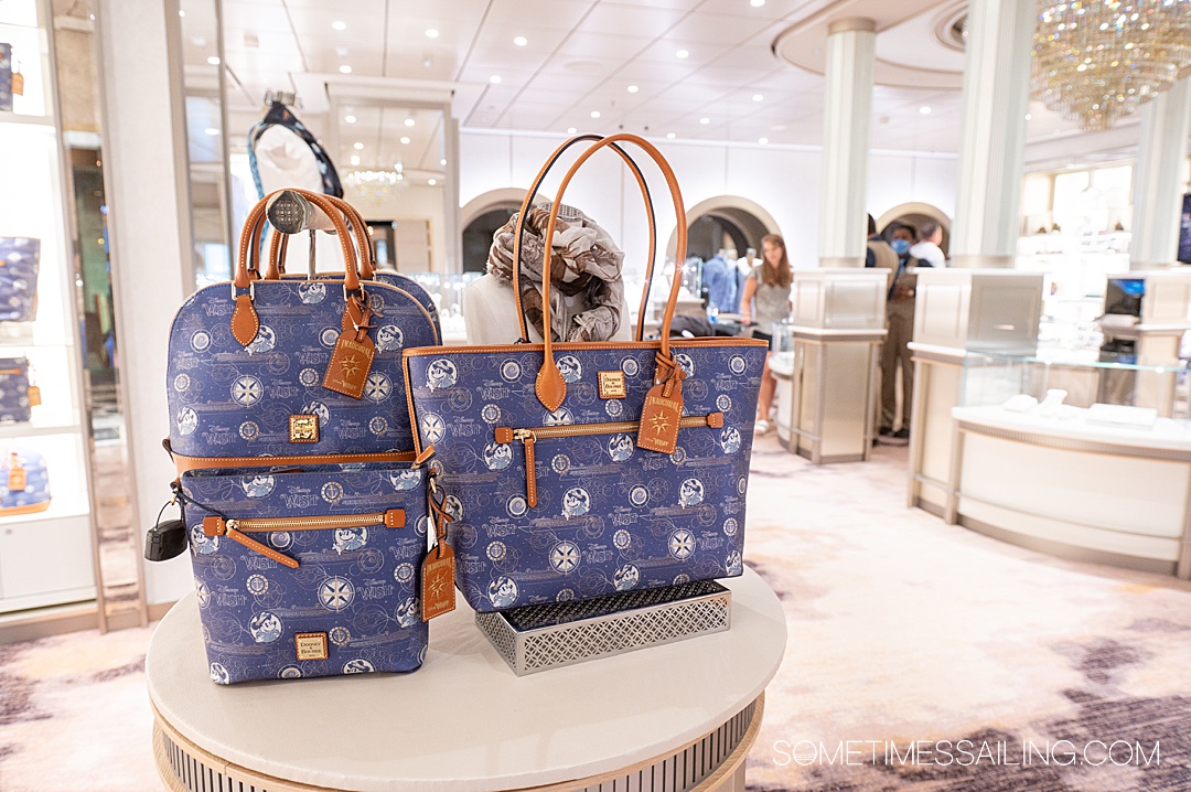 Disney Cruise Line themed Dooney and Burke purses at the stop on the Disney Wish ship.