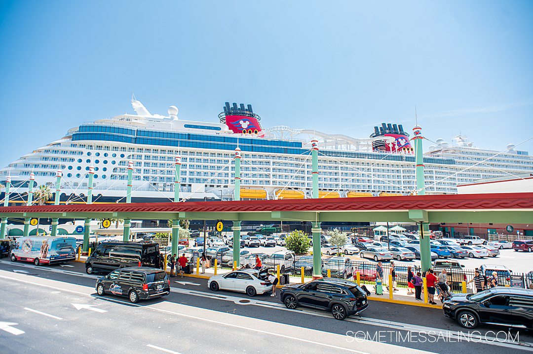 Disney Wish cruise ship in the distance at the Port Canaveral terminal in Florida for embarkation day.