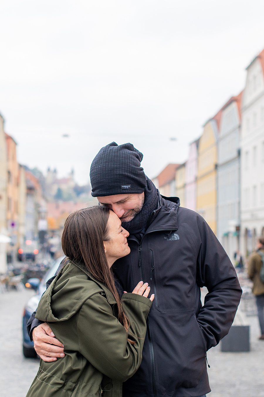 Couple sharing a moment on a street in Regensberg Germany.